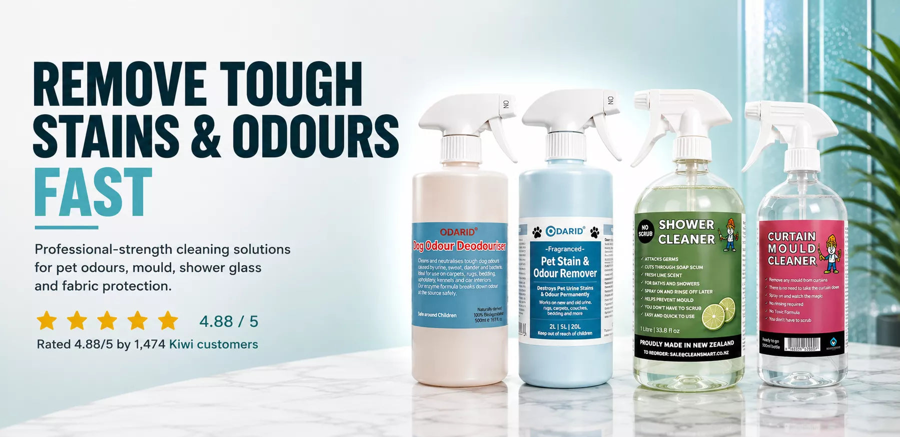 Four cleaning bottles with labels on a surface, with text promoting their use for removing tough stains and odors.