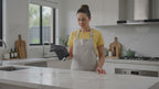CleanSmart Water-Only Cloth wiping a marble benchtop clean with just water