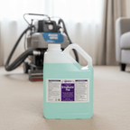 UrineMaster Plus 5L fragranced urine odour and stain remover bottle on carpet beside a professional carpet cleaning extraction machine